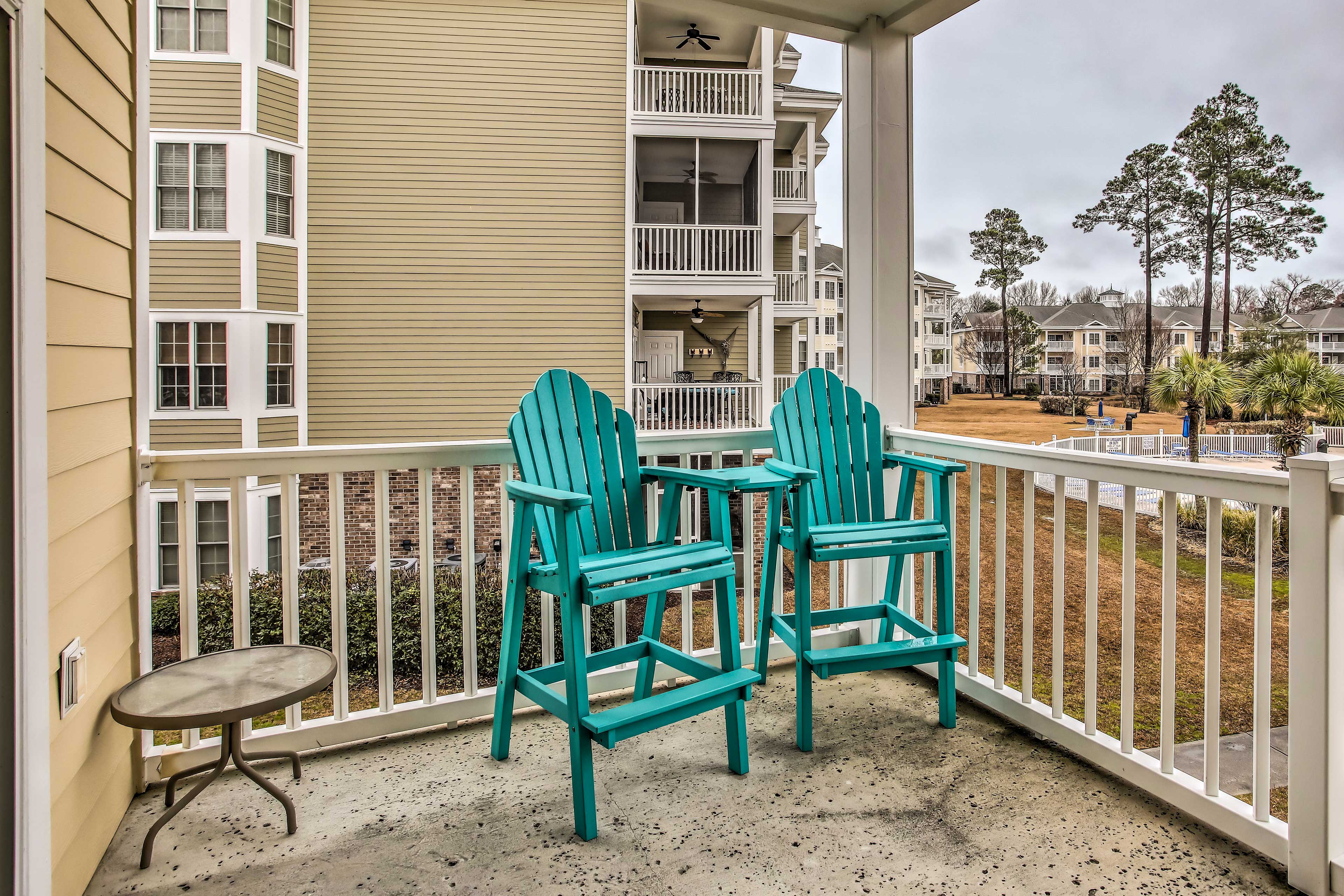 Private Balcony w/ Seating Area | Pool & Golf Course Views