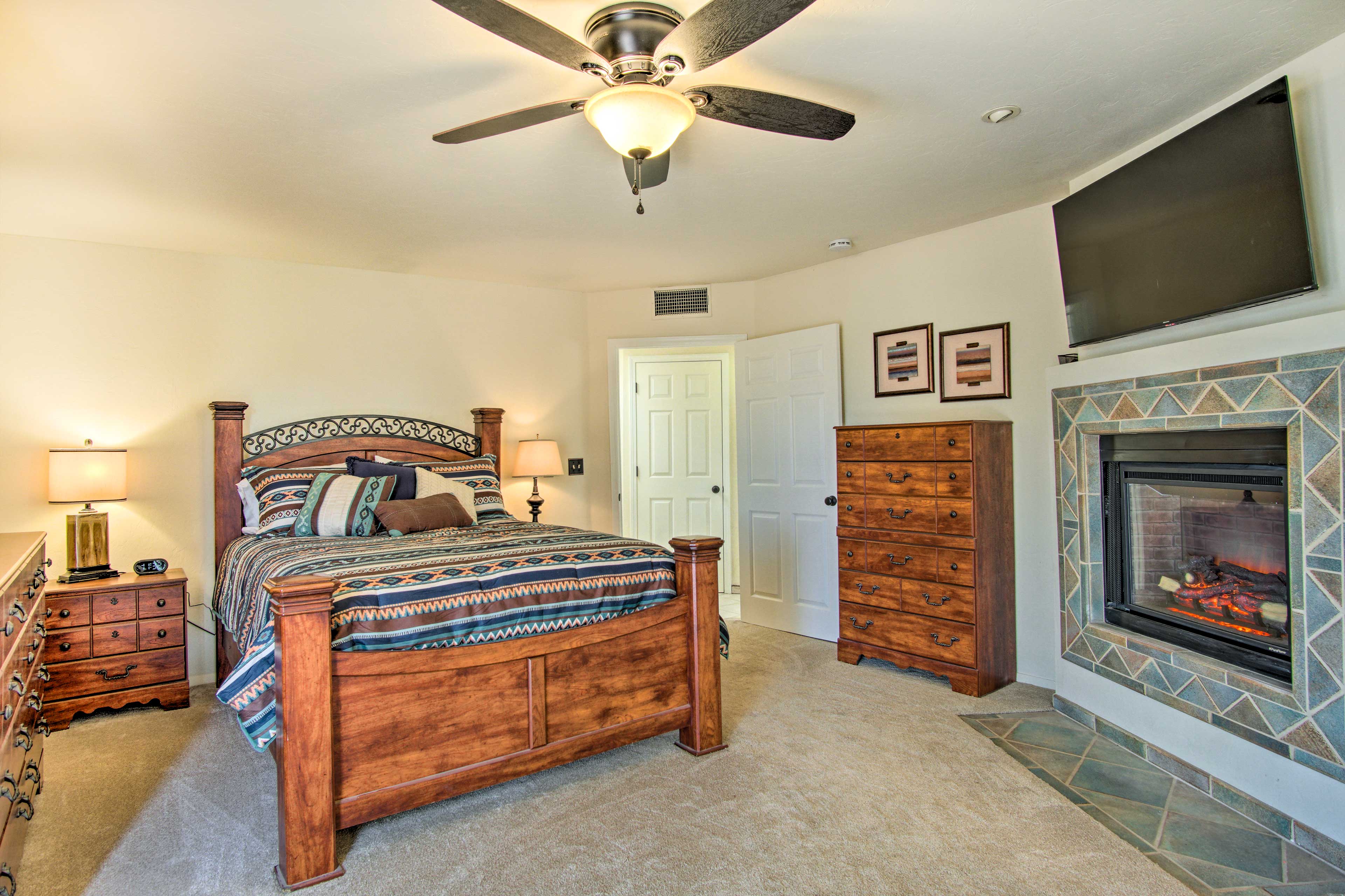 Bedroom 1 | California King Bed | Electric Fireplace | Linens Provided