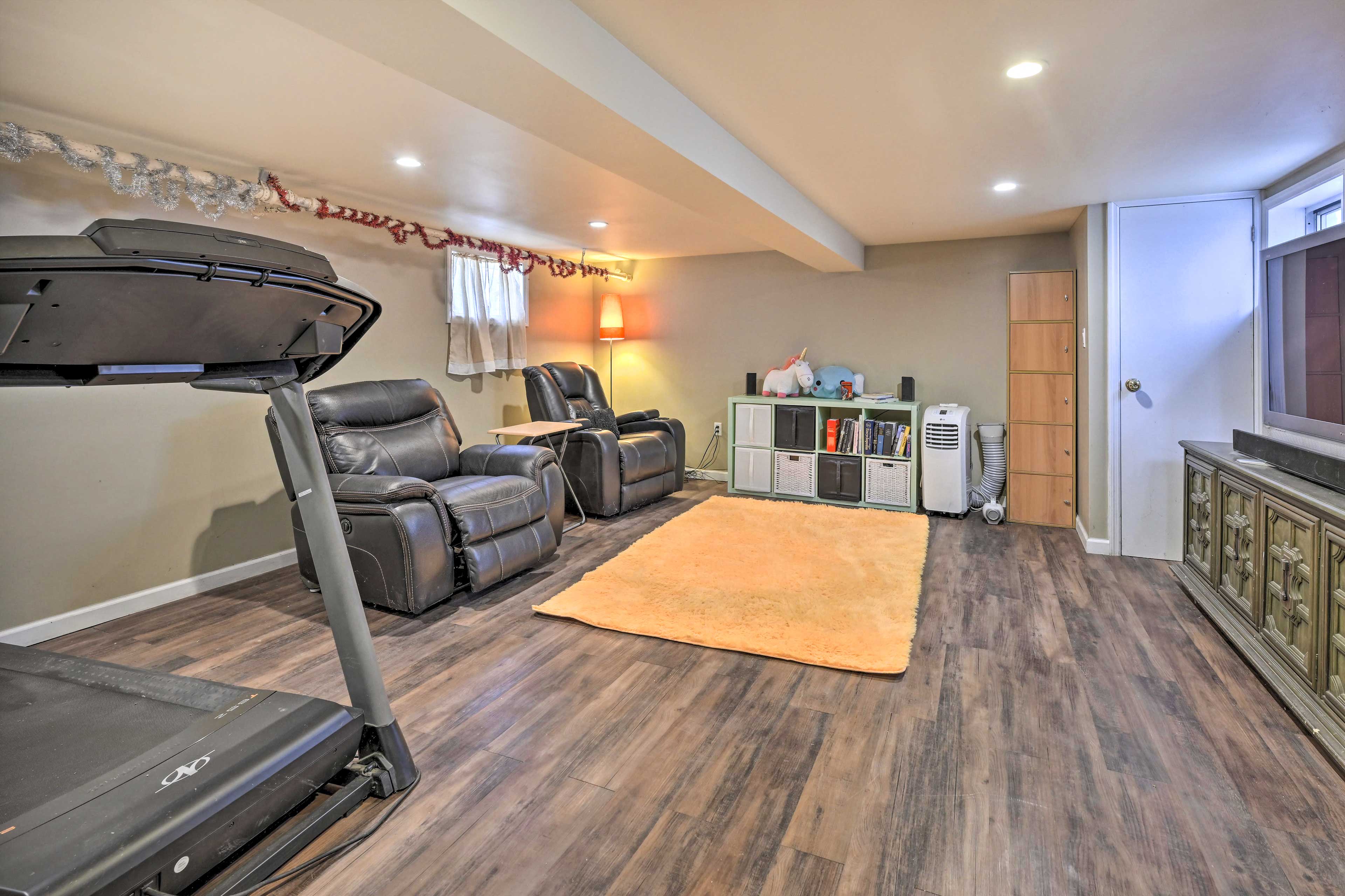 Additional Living Area | Basement | Flat-Screen TV | Treadmill | Books