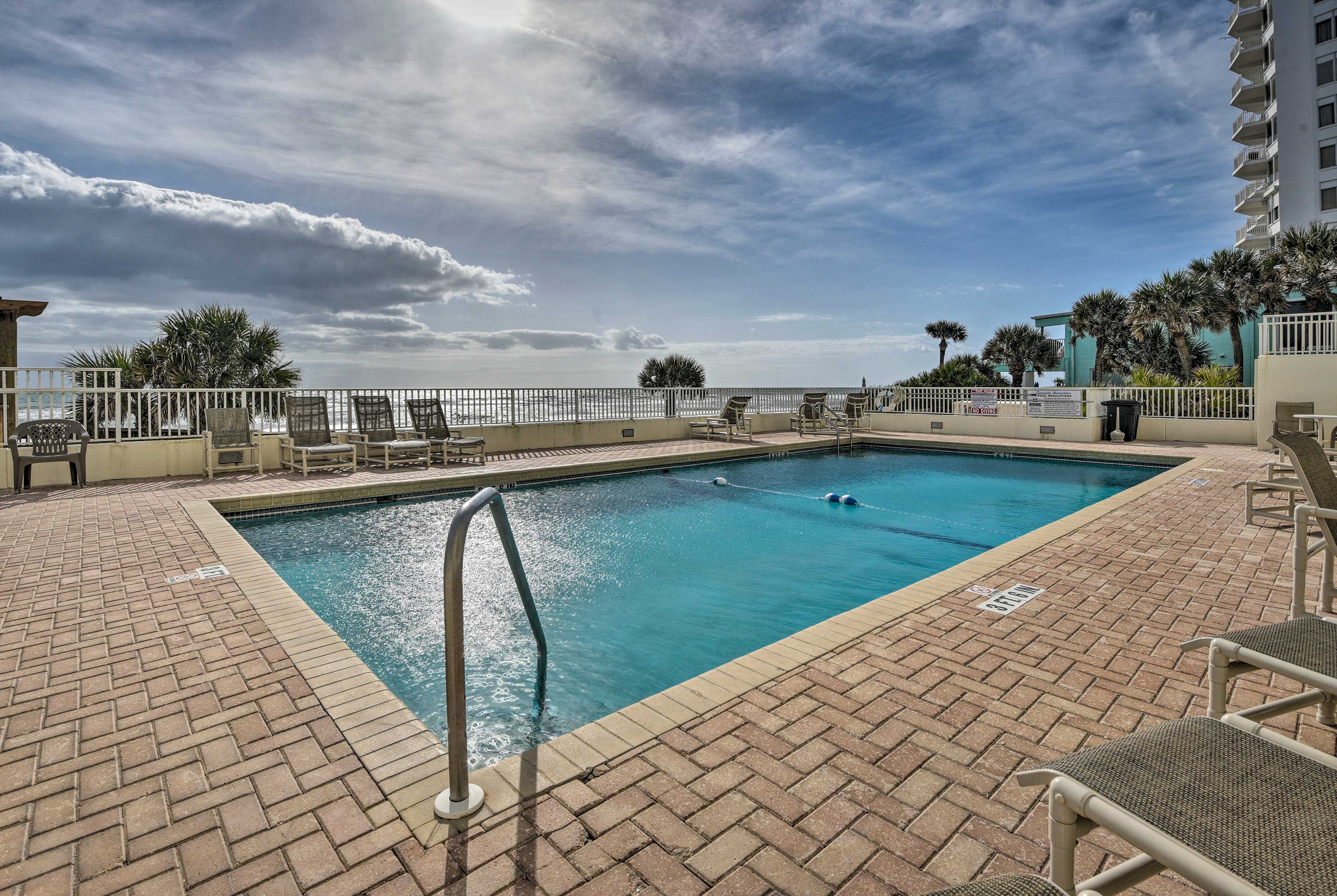 Community Amenities | Heated Outdoor Pool | Beach Access | Beach Chairs & Towels