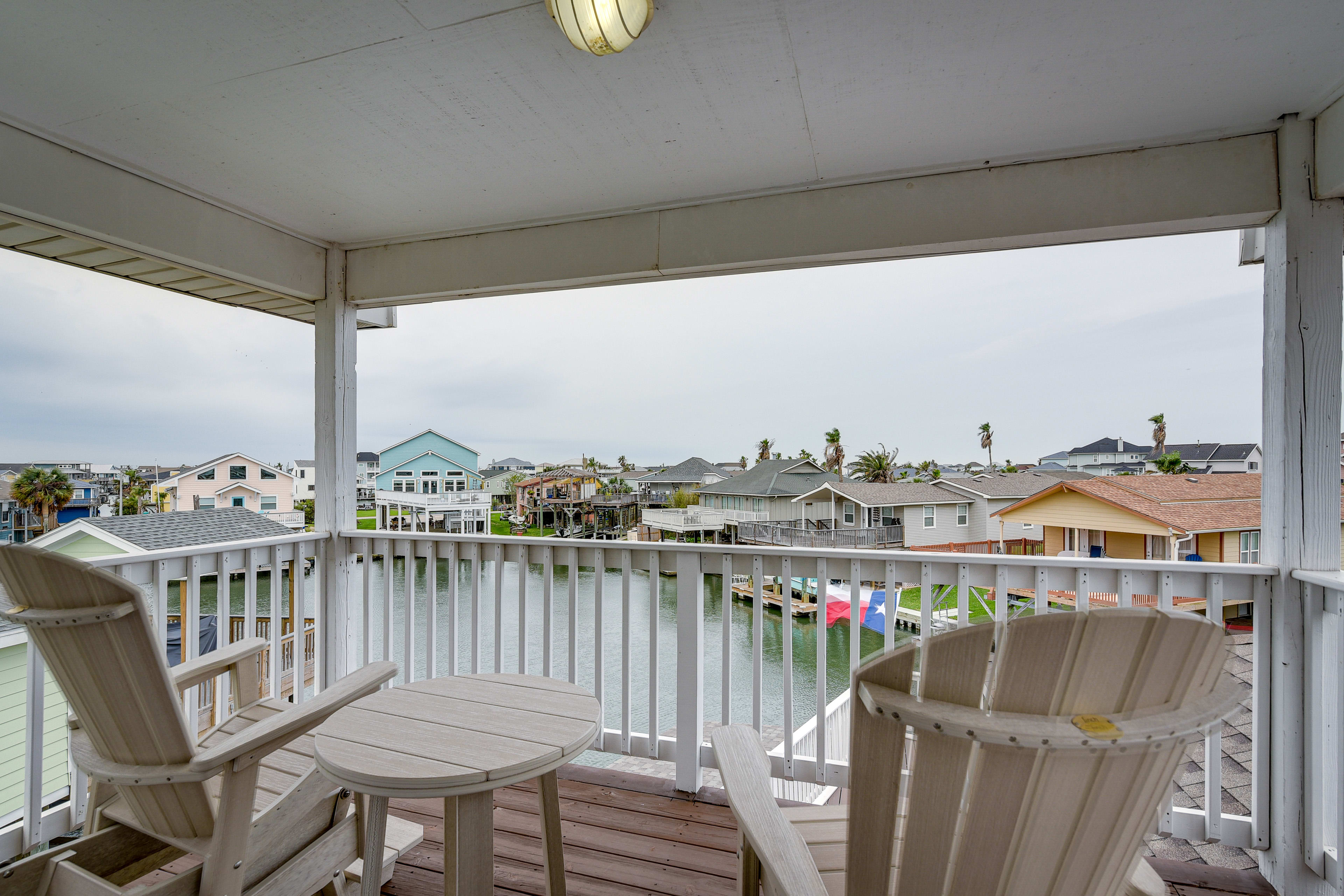 Balcony | Outdoor Seating & Dining | West Bay Views