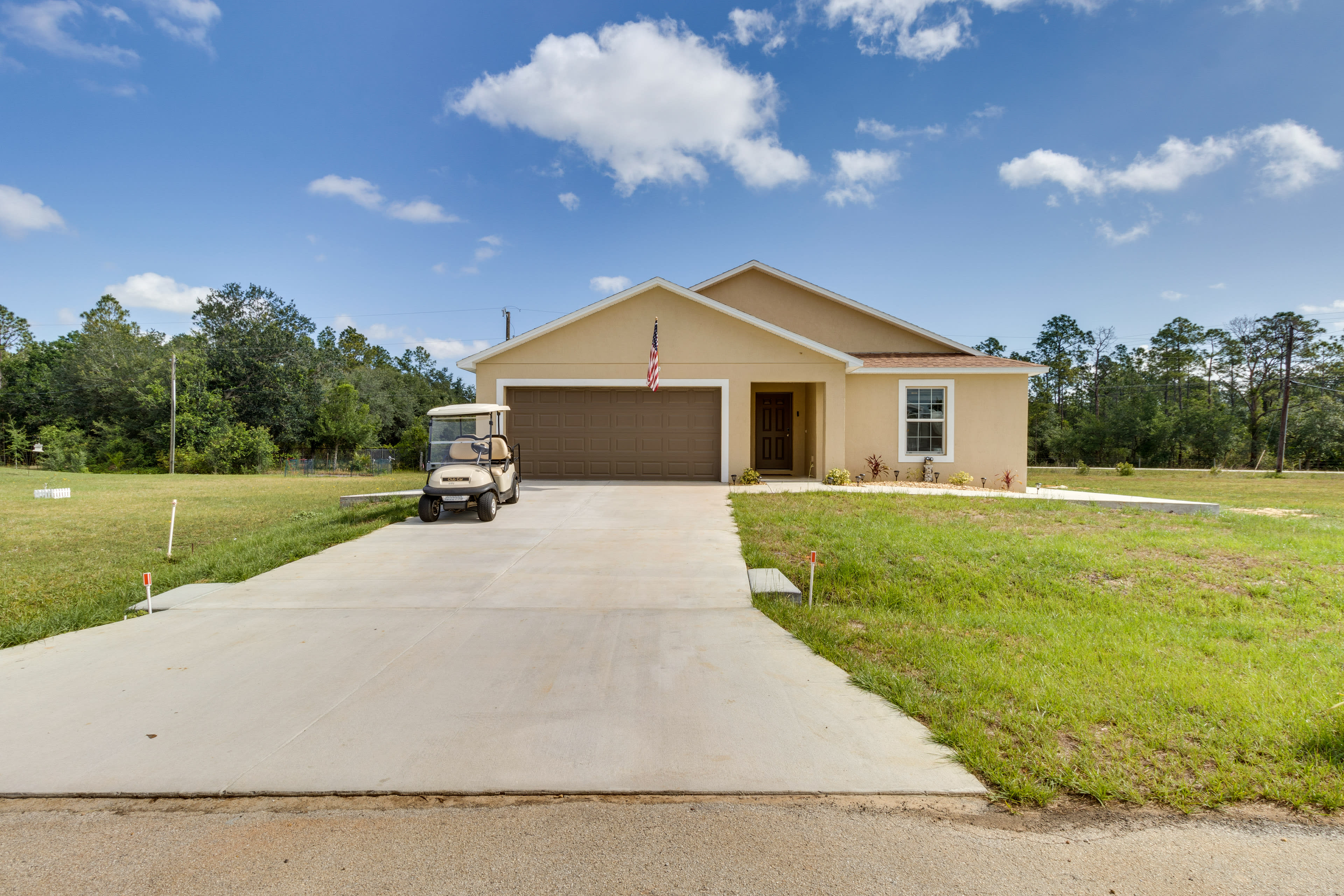 Property Exterior | Complimentary Golf Cart | Garage (2 Vehicles)