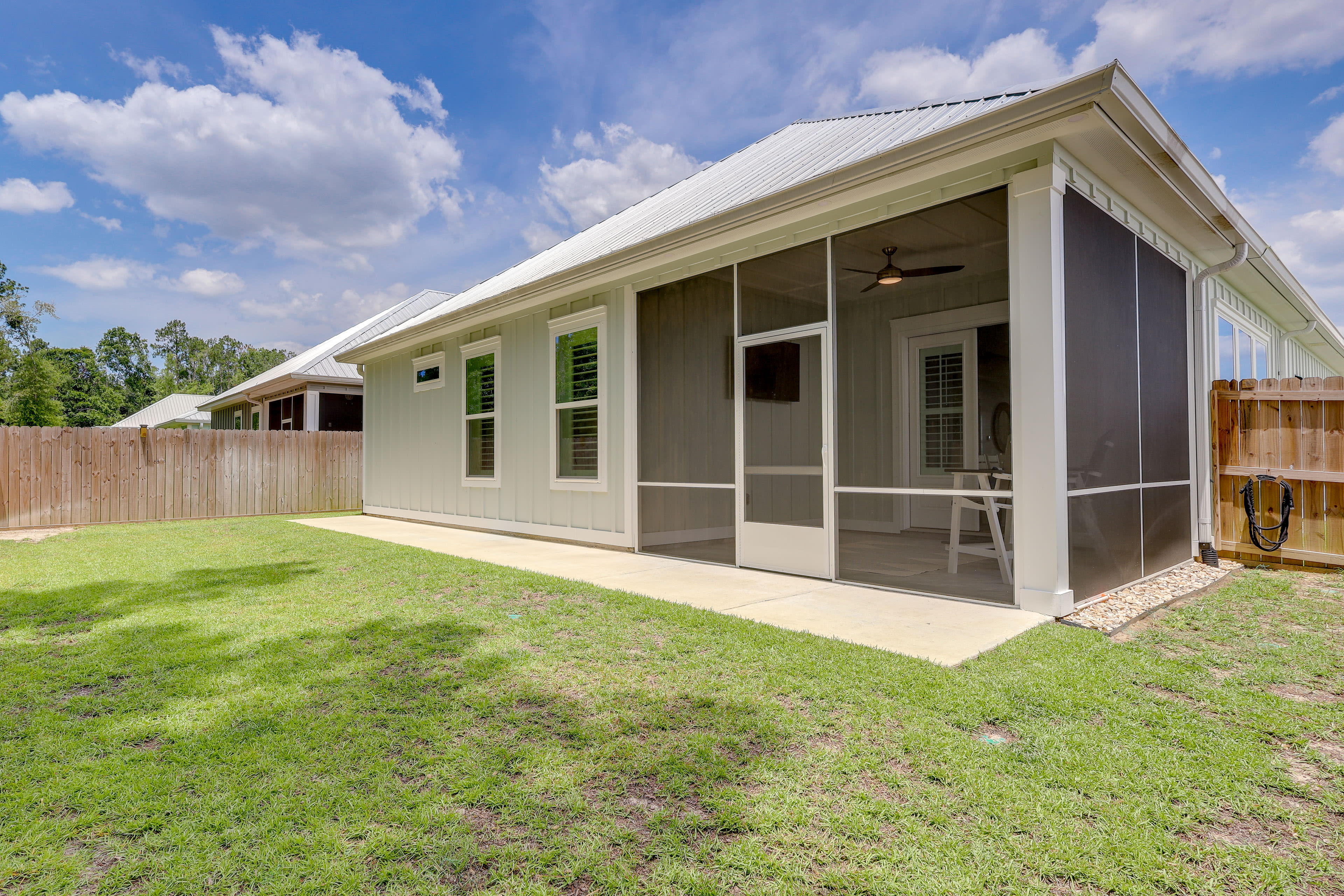 House Exterior | Screened-In Patio | Grill | Fenced Yard