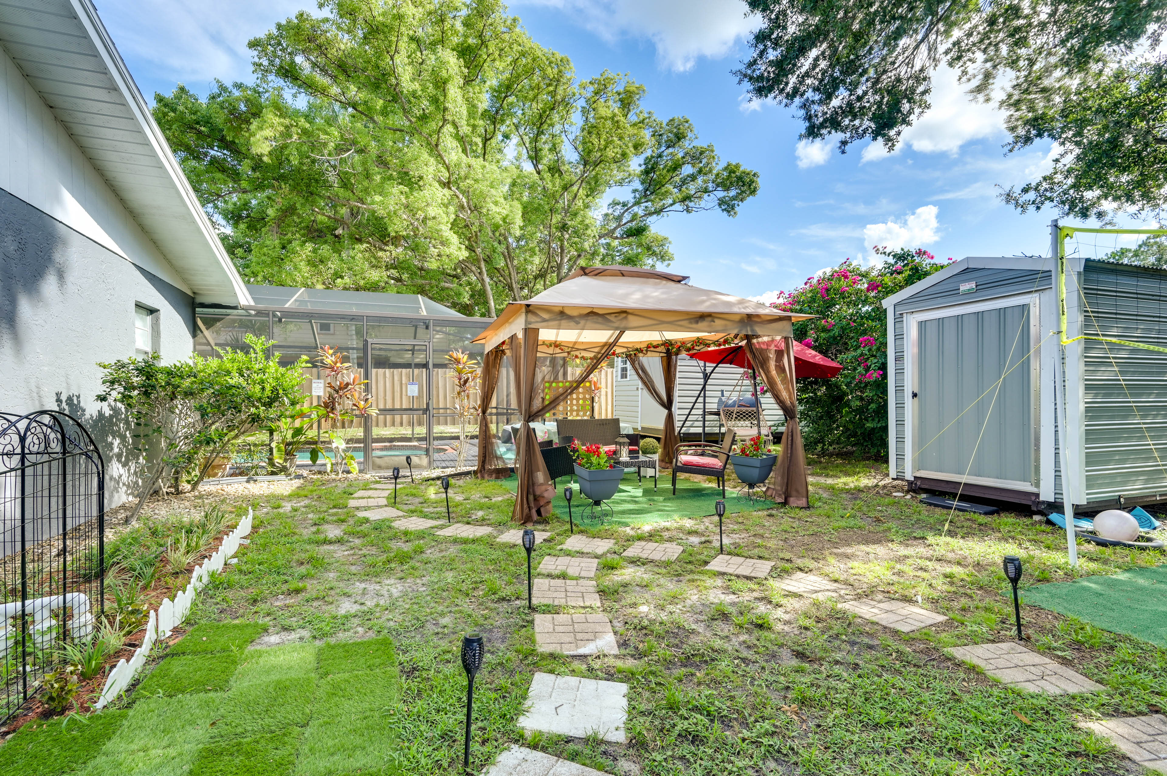 Studio Exterior | Shared Fenced Yard | Additional Seating Area