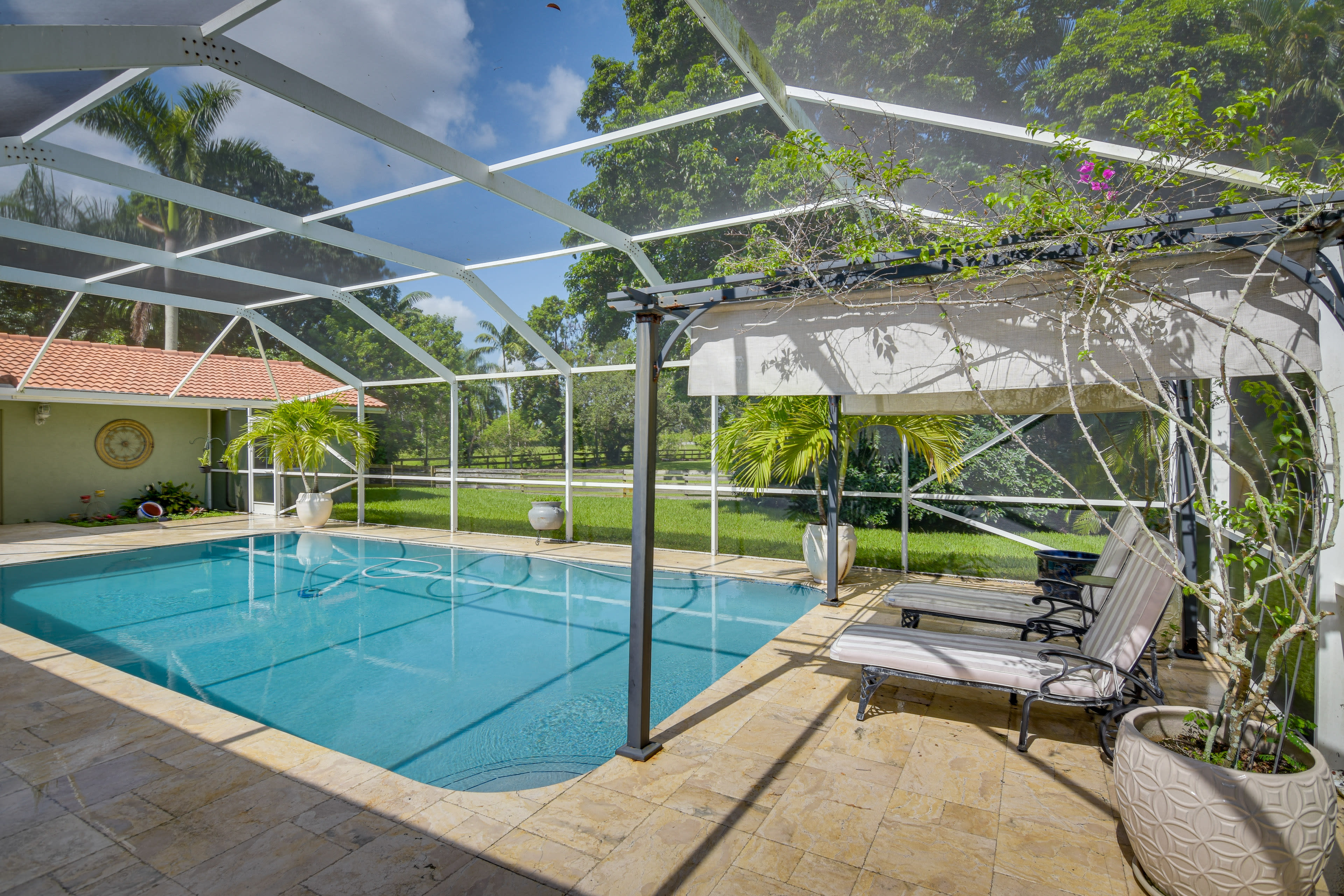 Private Screened-In Lanai | Outdoor Pool | Lounge Chairs