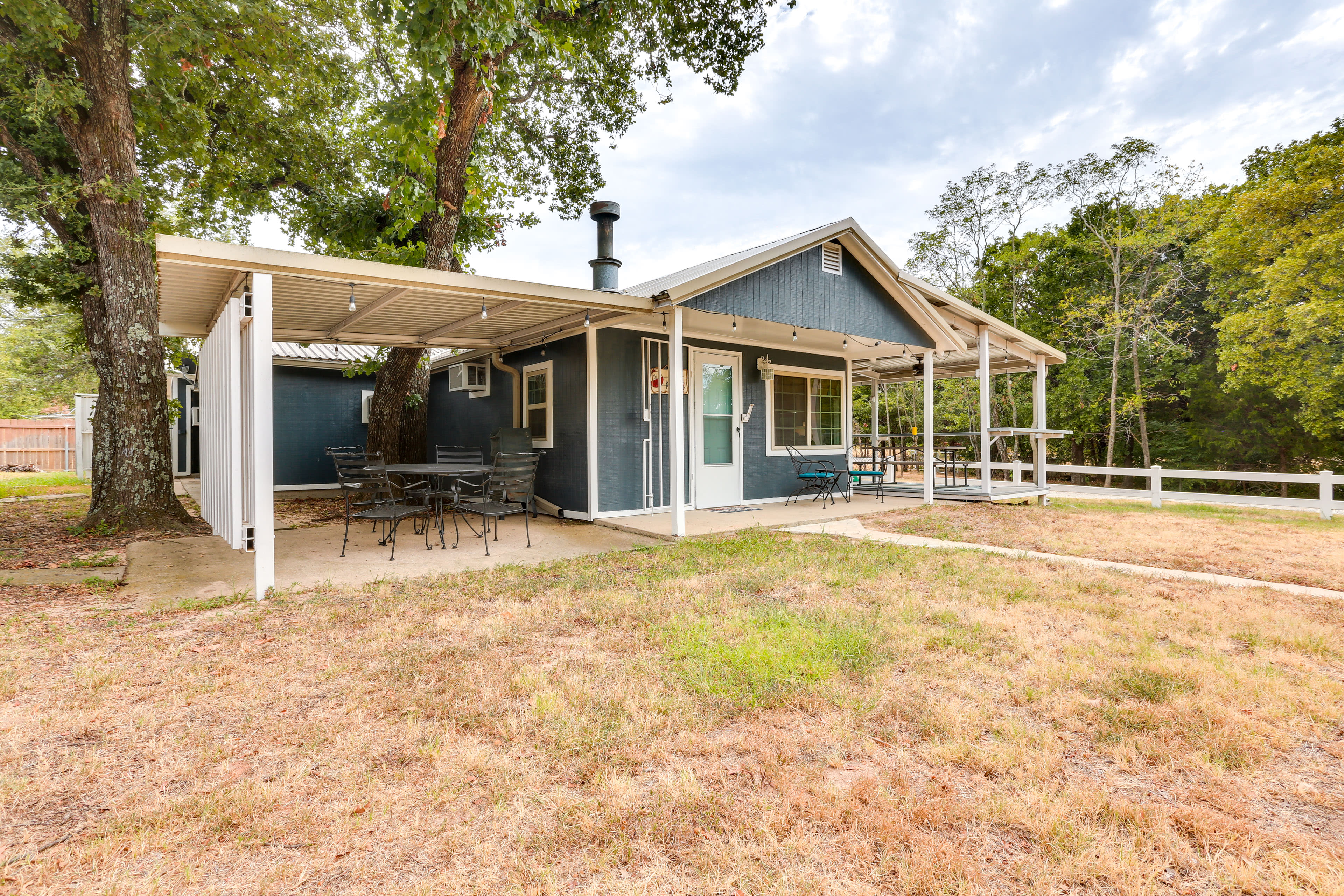 Cabin Exterior | Indoor Fireplace | Walk to Lake Texoma | Golf Cart Available