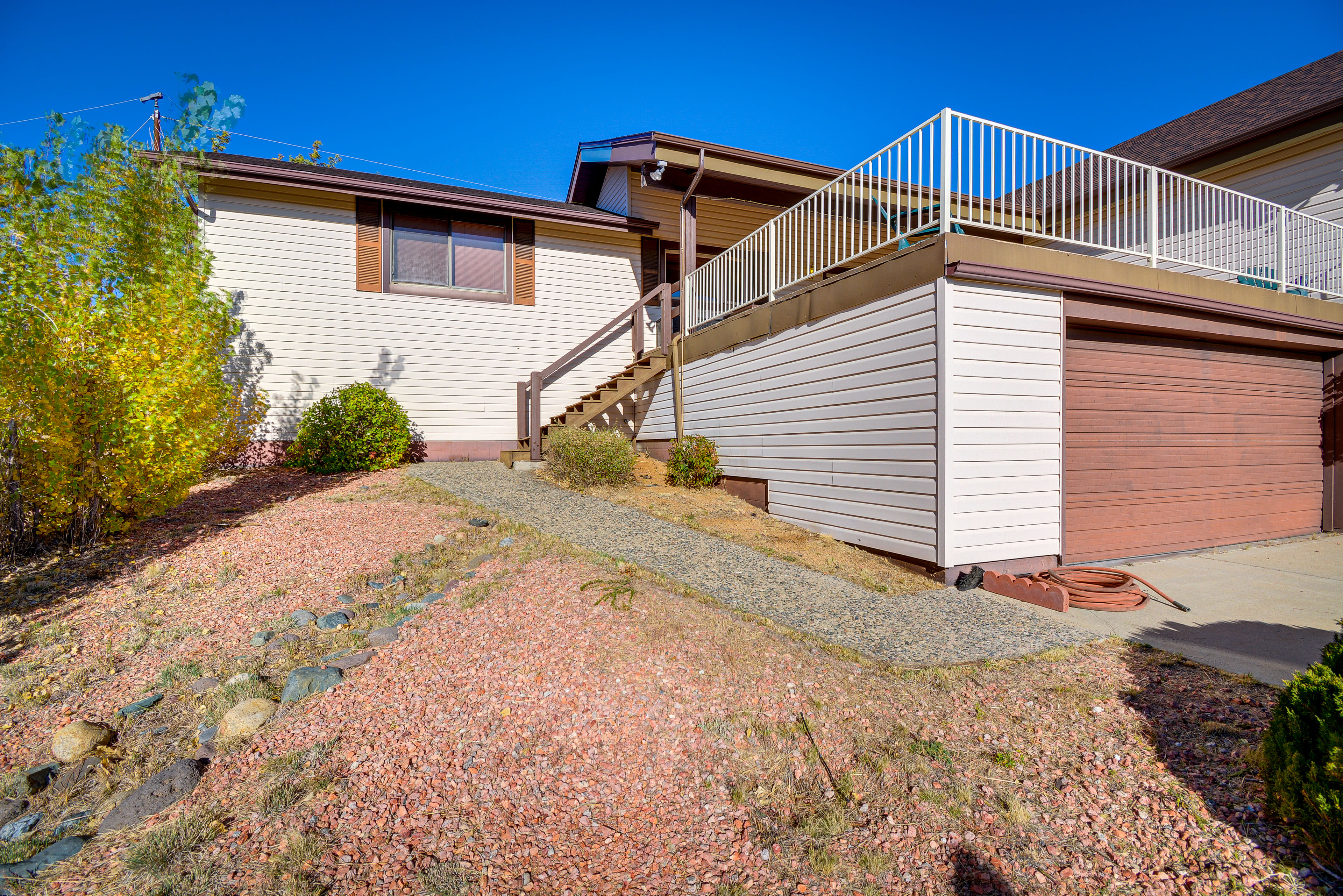 Parking | Driveway (4 Vehicles) | Exterior Staircase to Enter Home