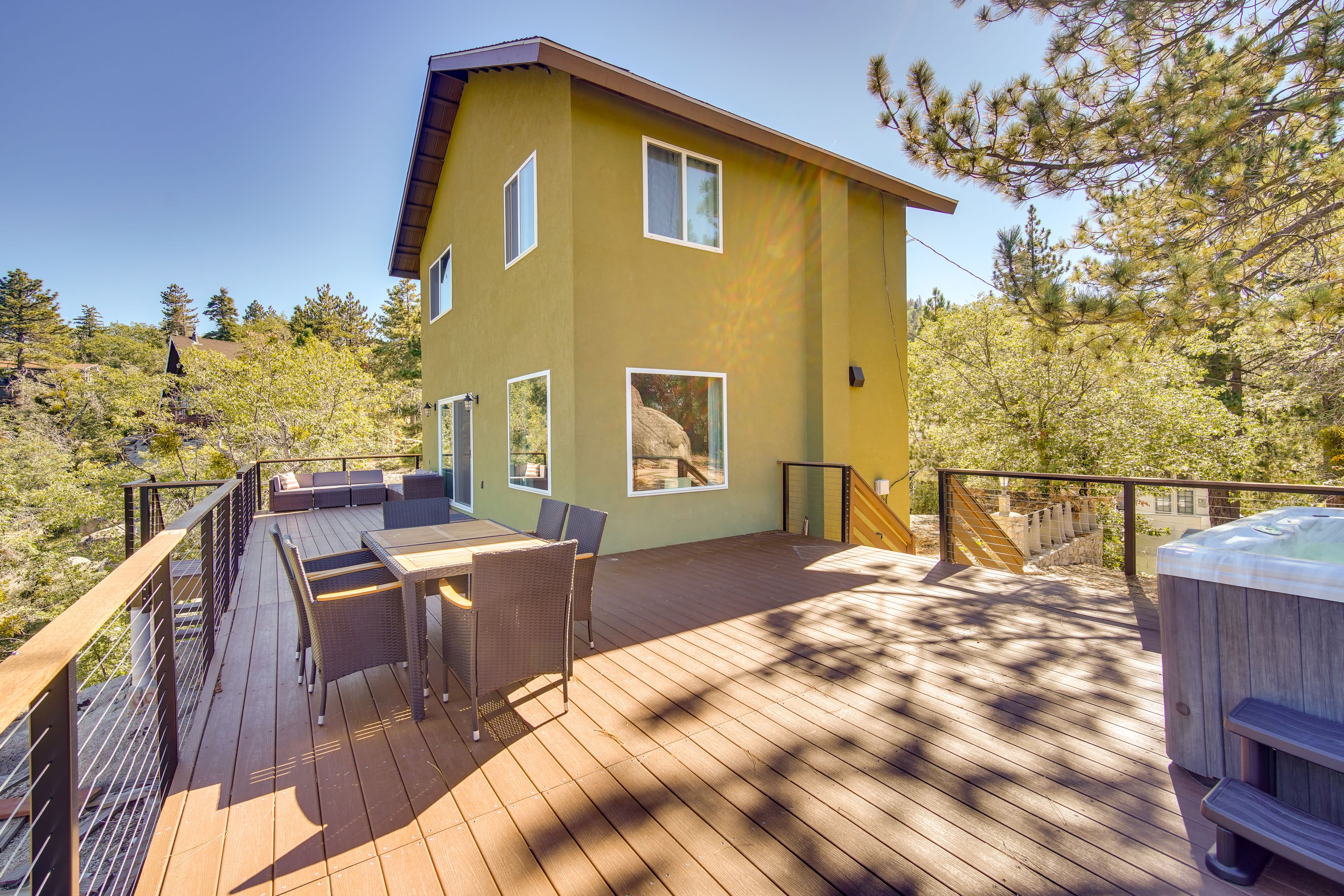 Cabin Exterior | Spacious Deck | Private Hot Tub