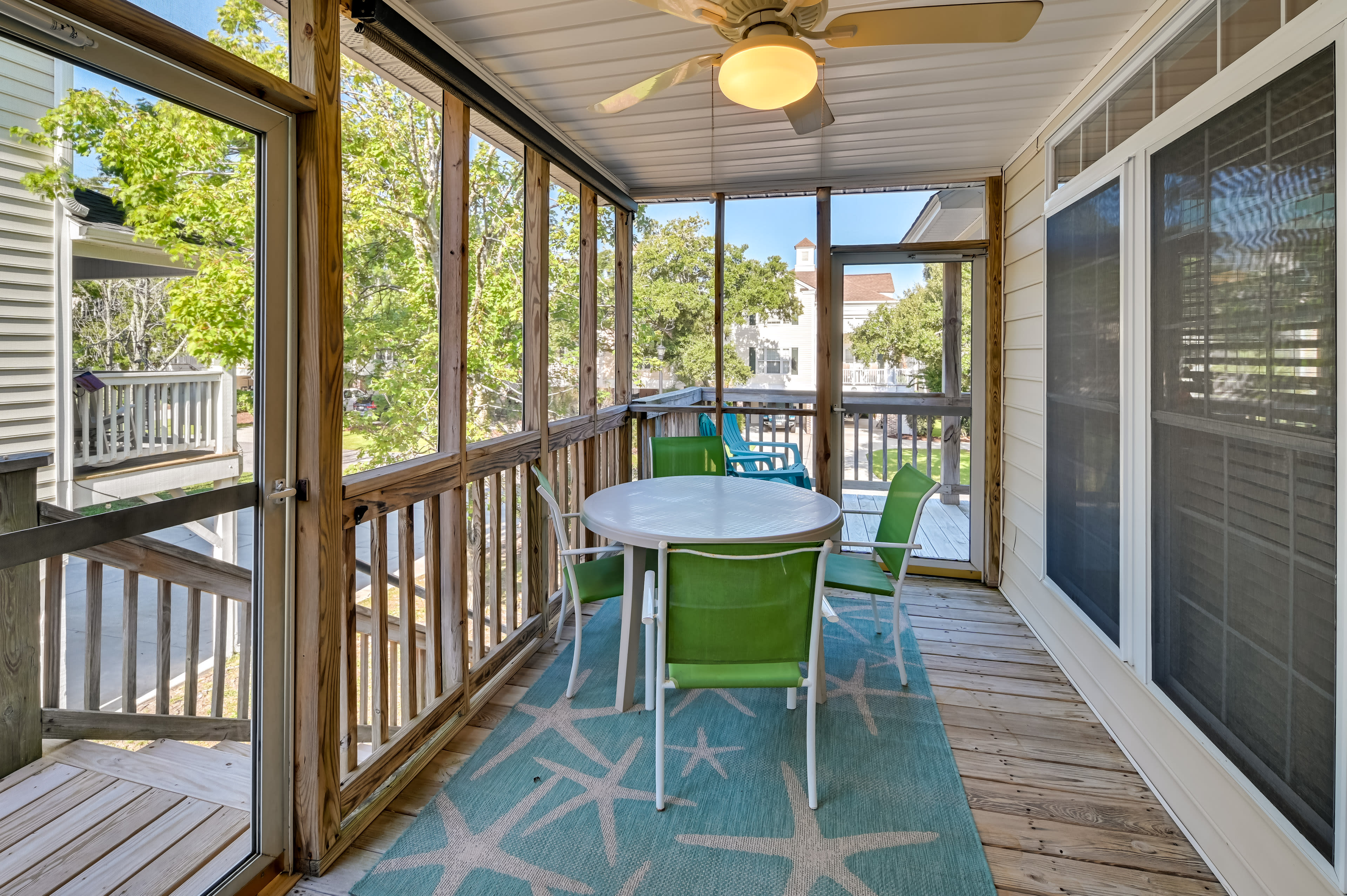 House Exterior | Screened Deck w/ Dining Area