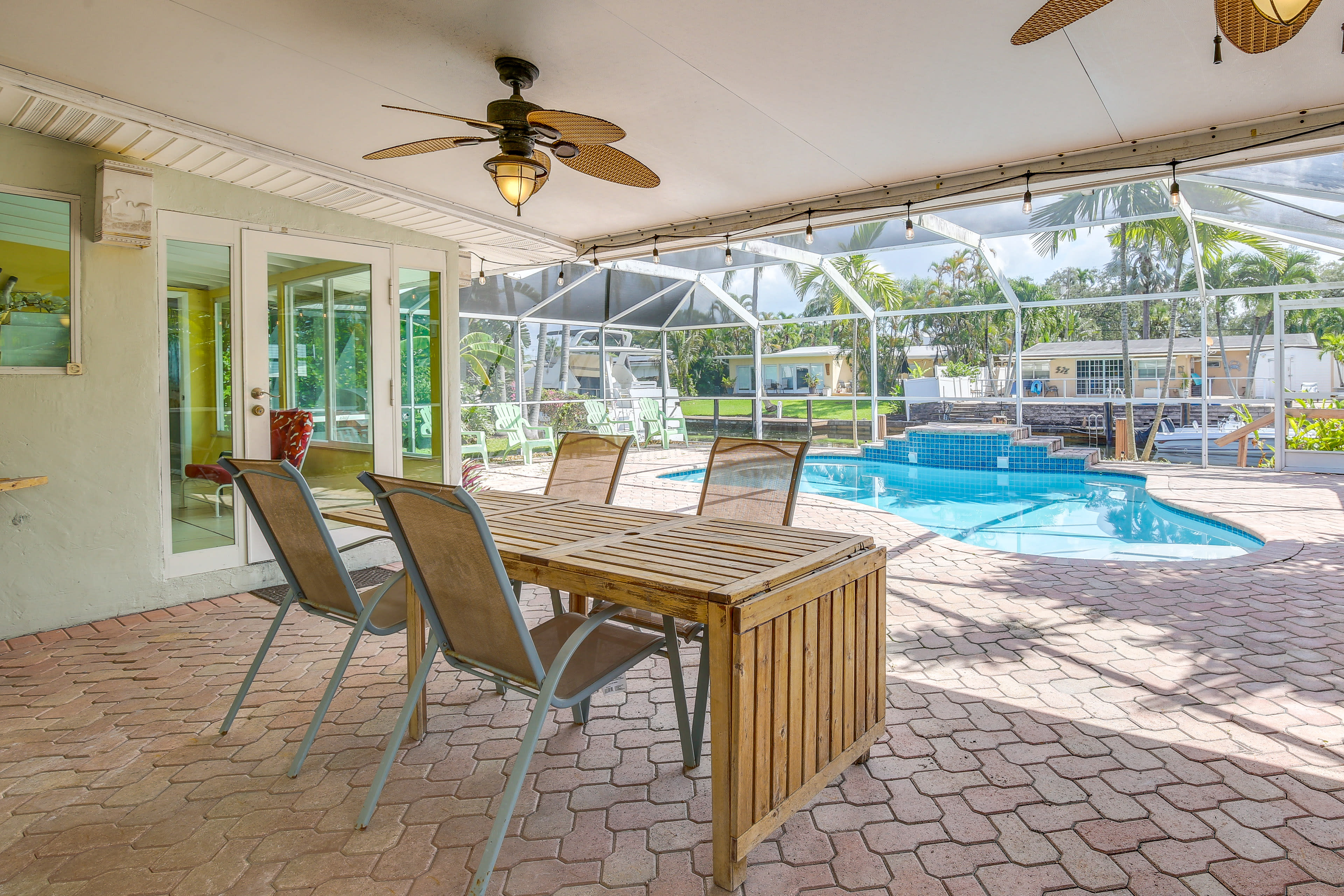 Lanai | Private Outdoor Pool (Heated w/ Fee) | Outdoor Dining Area