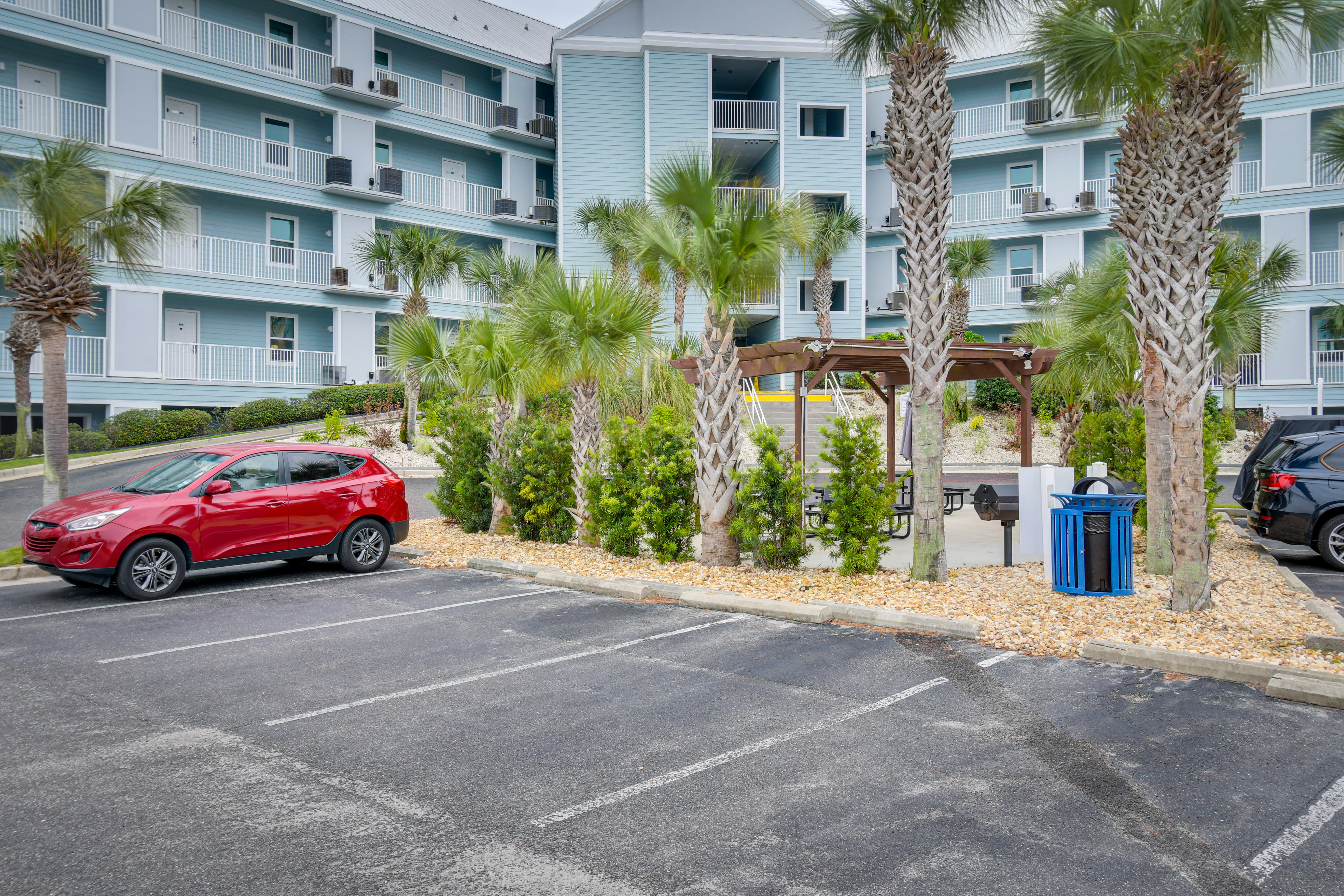 Property Exterior | Community Parking Lot (1 Vehicle, Parking Pass Provided)