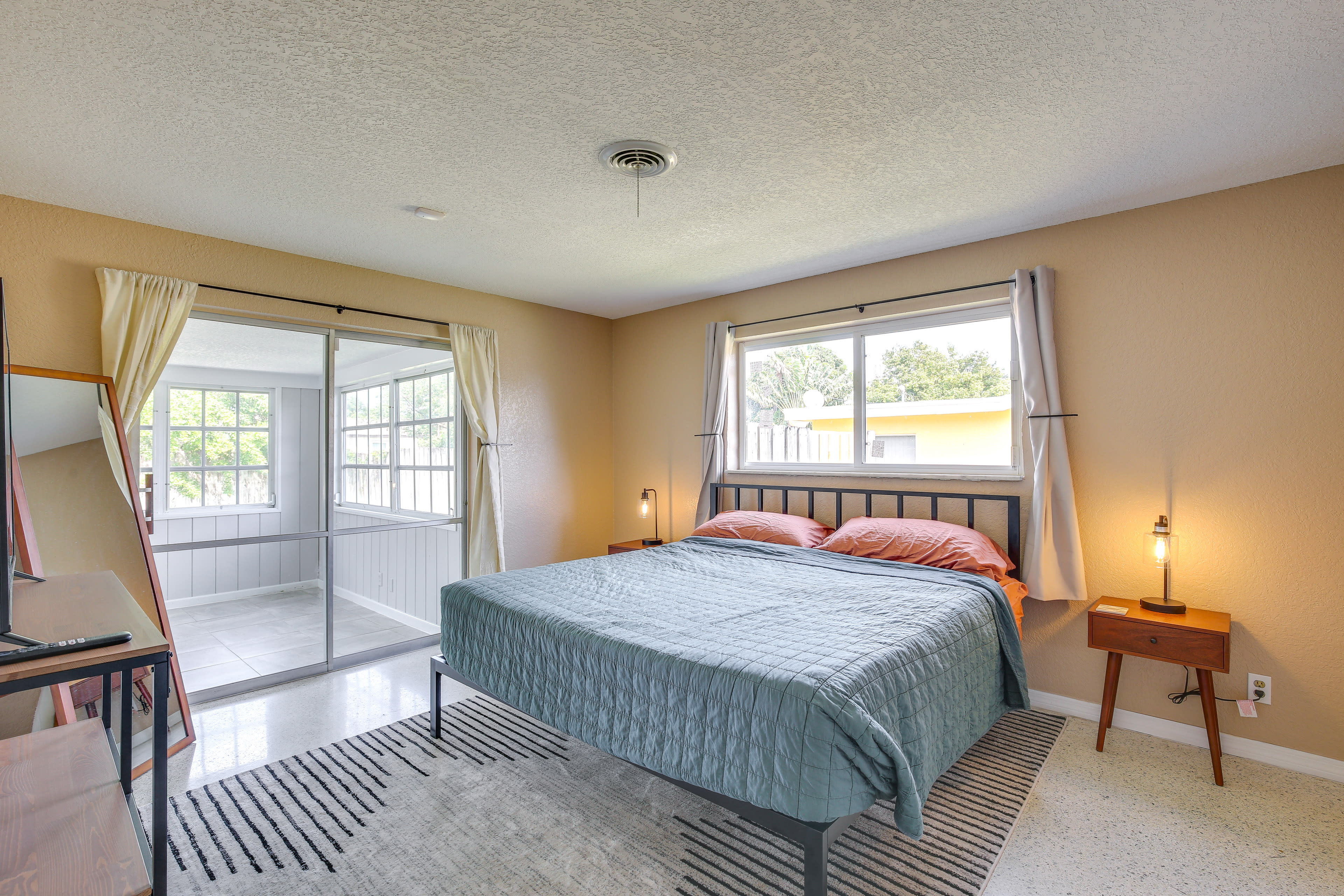 Bedroom Suite | King Bed | Access to Sunroom | Flat-Screen TV