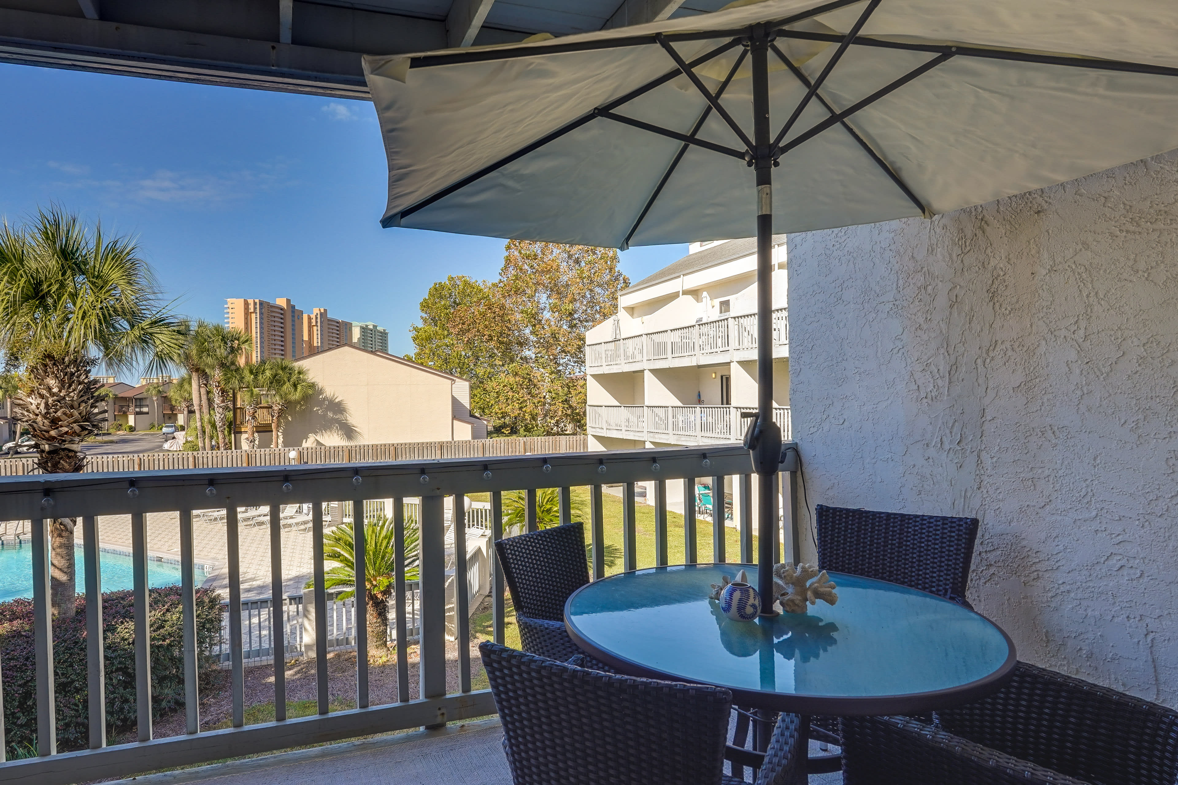 Private Balcony | Outdoor Dining Area | String Lights | Lounge Seating