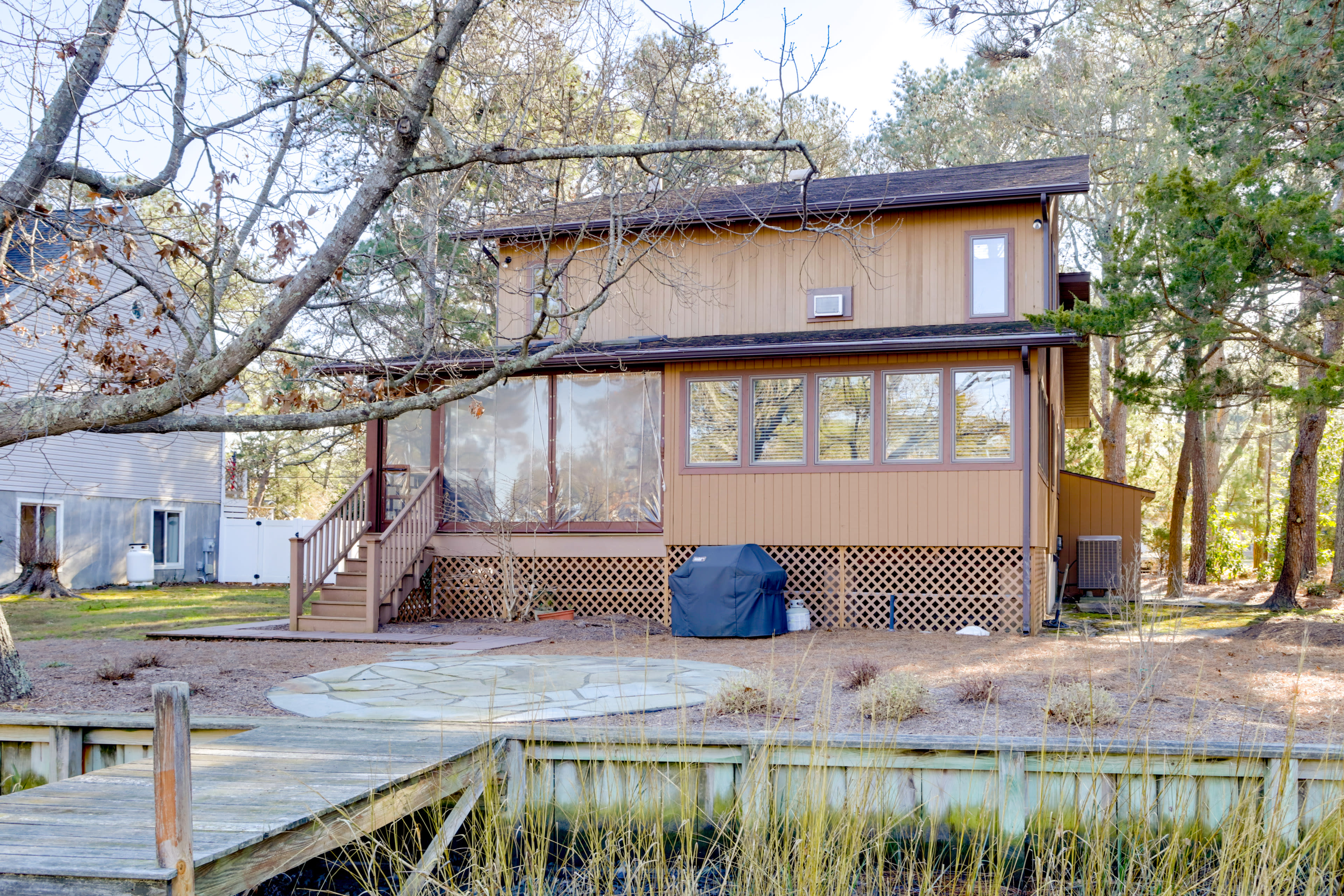 Back Exterior | Canal Dock | Screened Porch | Gas Grill | Outdoor Shower