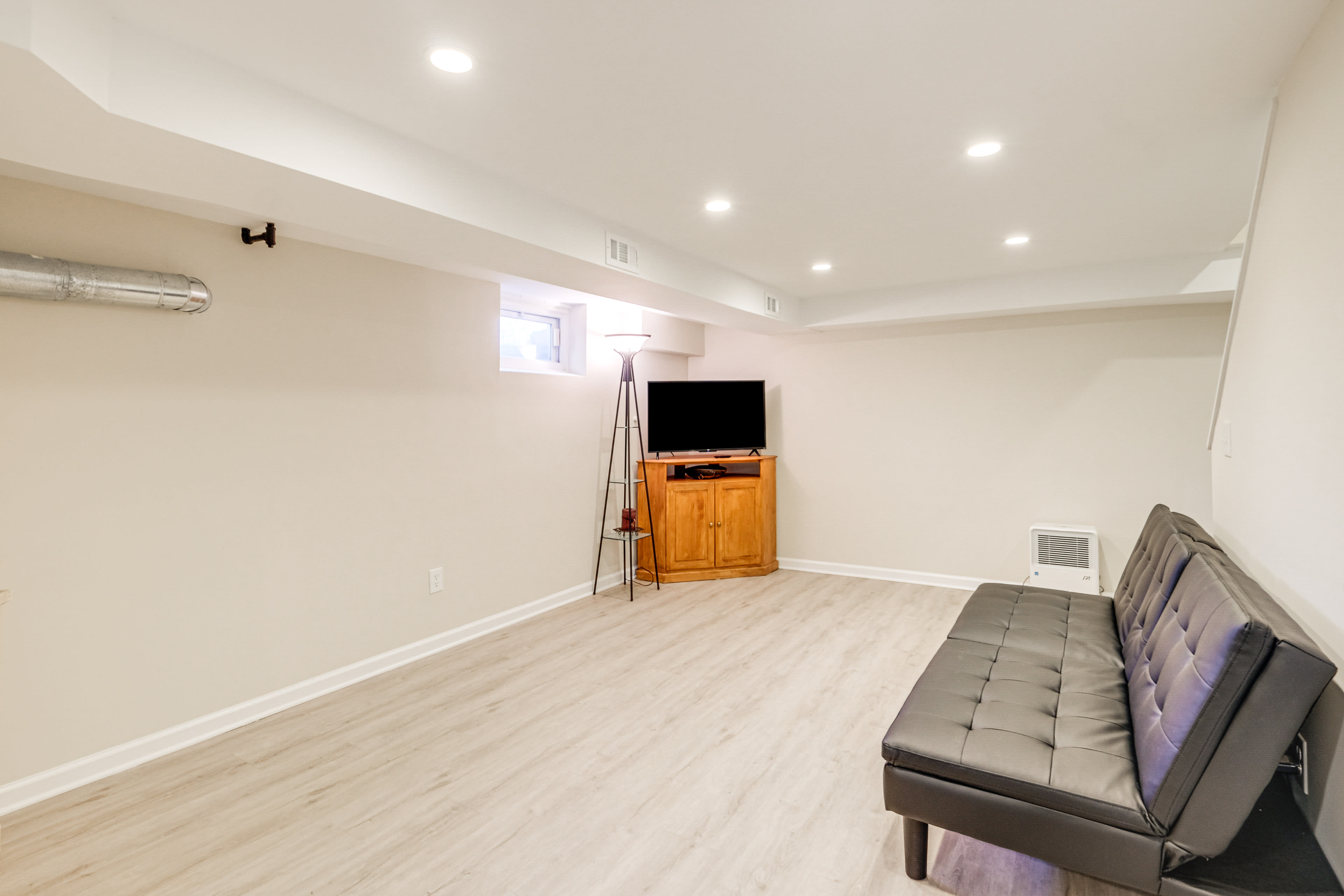 Basement Living Room | Full Futon | Stairs Required