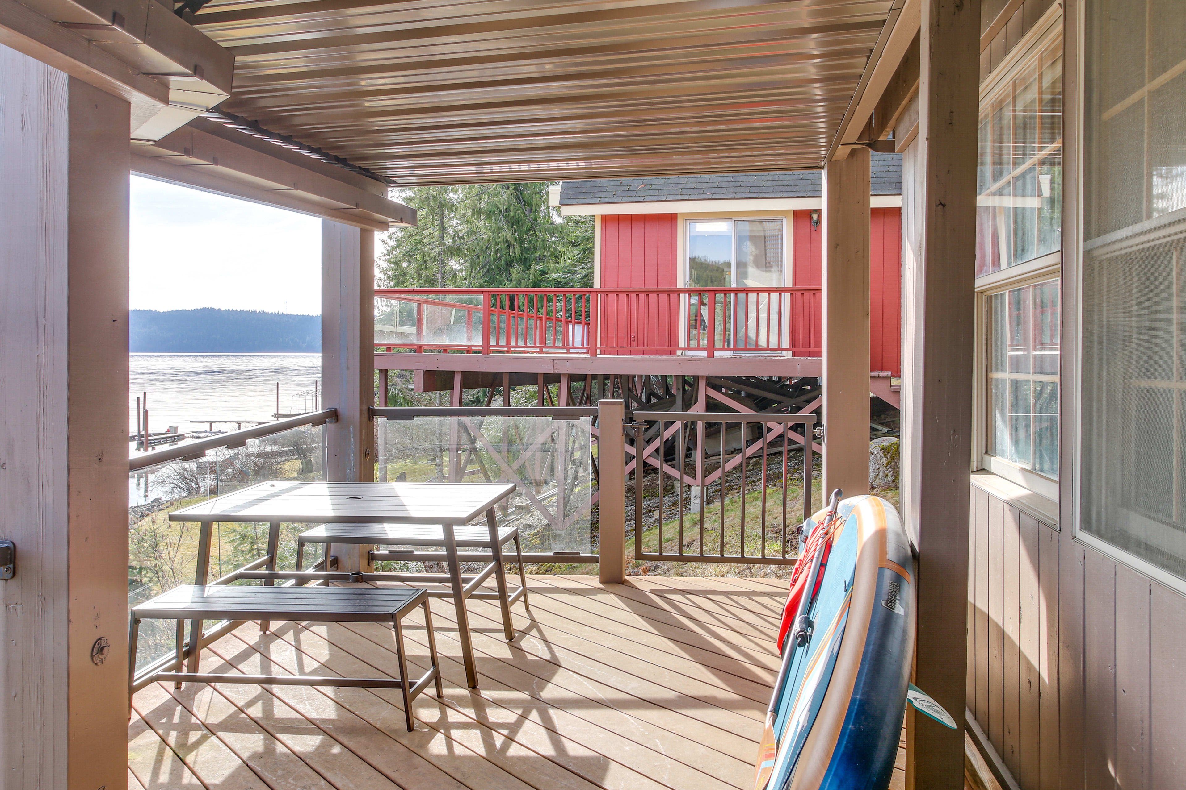 Covered Deck | Dining Area | Expansive Water Views