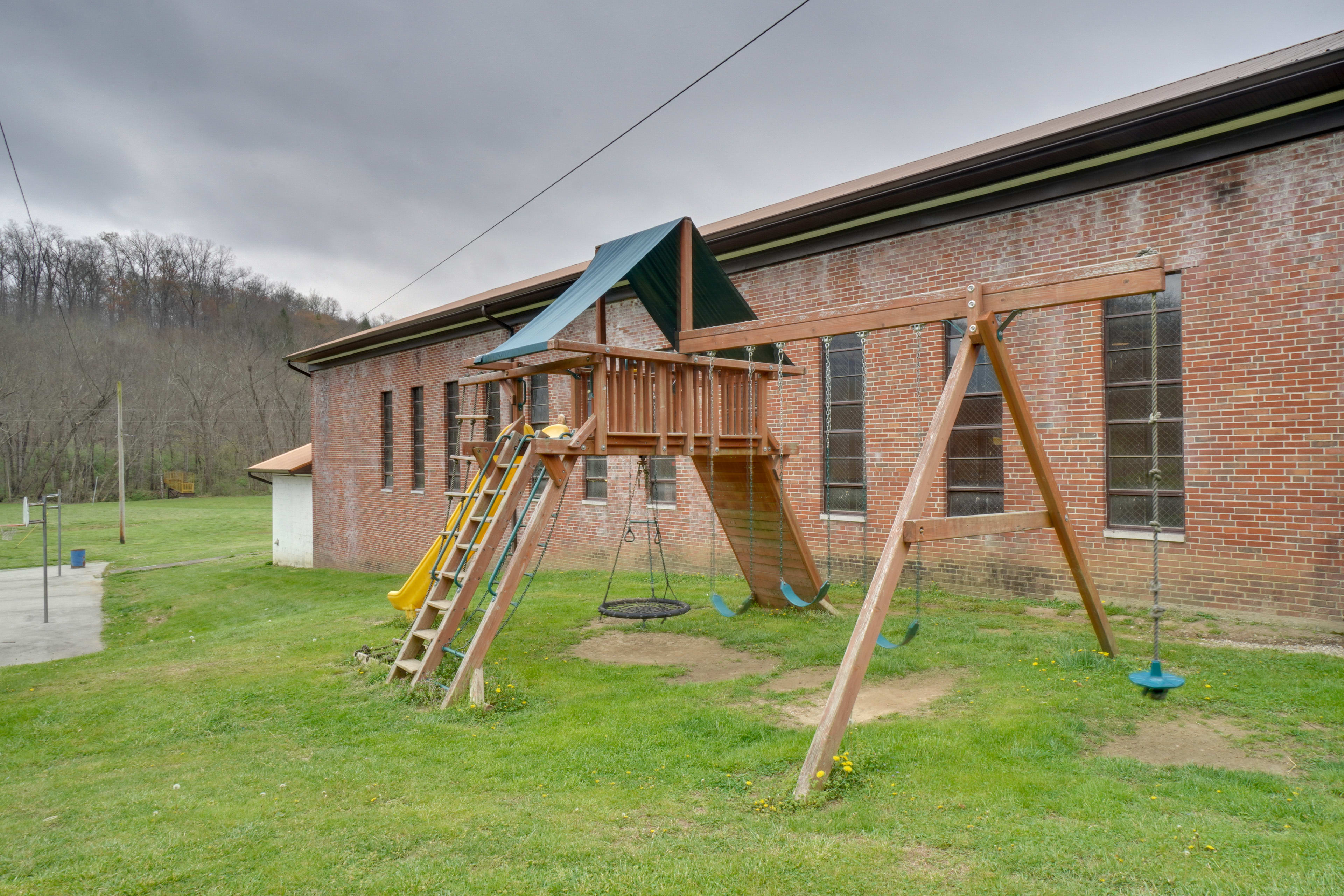 Studio Exterior | Single-Story Unit | Community Playground | ATV Trails On-Site