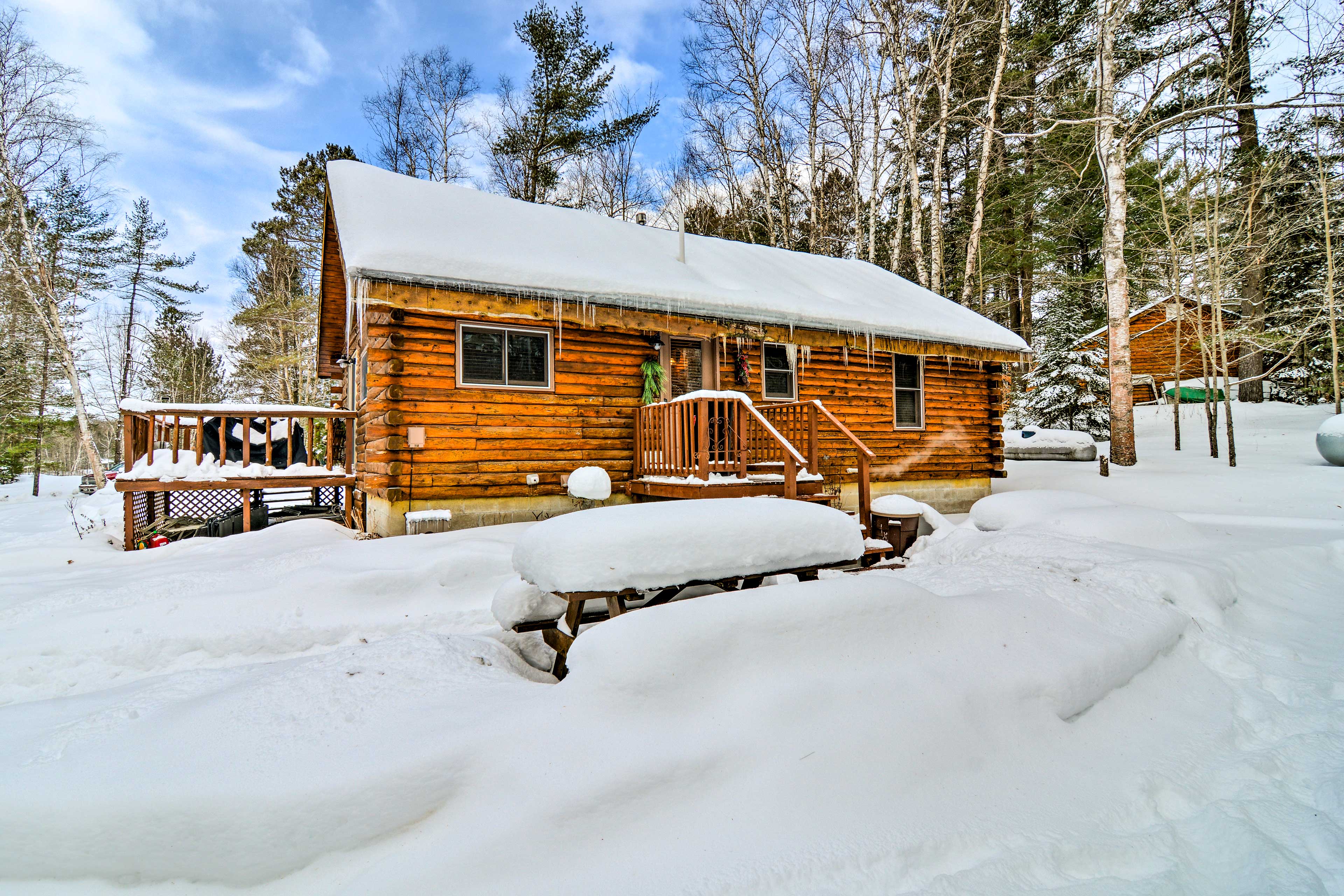 Cozy Manistique Cabin w/ Deck, Grill & Fire Pit! Evolve