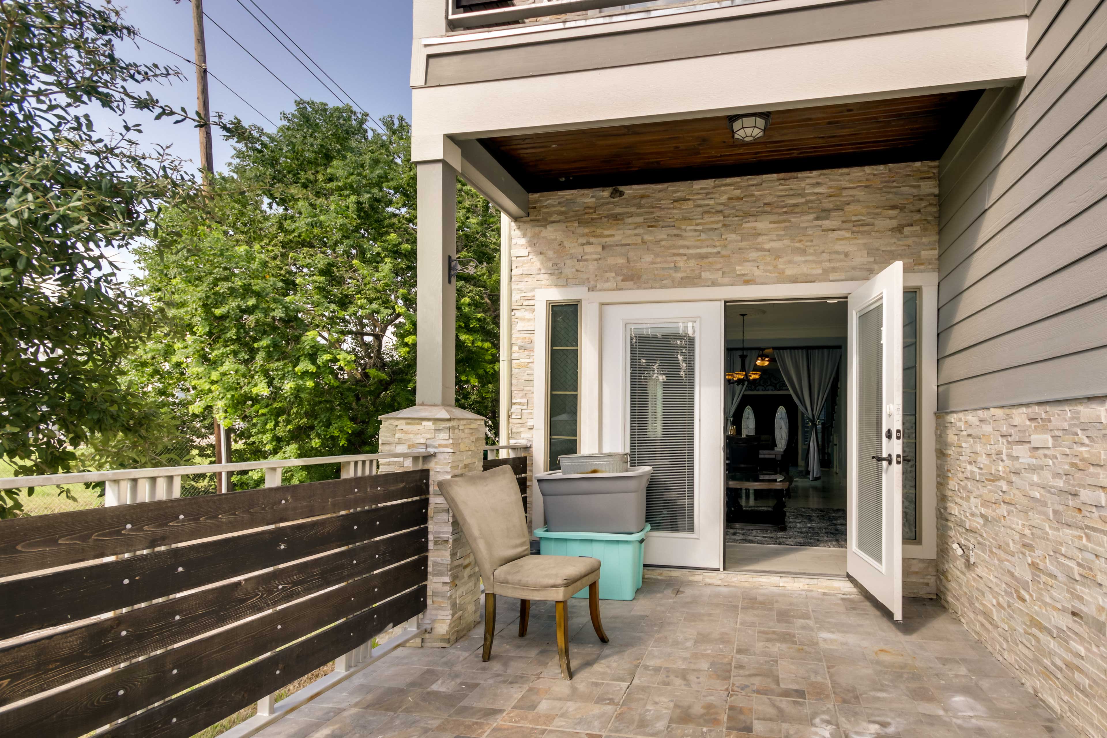 View of Luxe Southwest Houston Home w/ Balconies & Patio! | Evolve