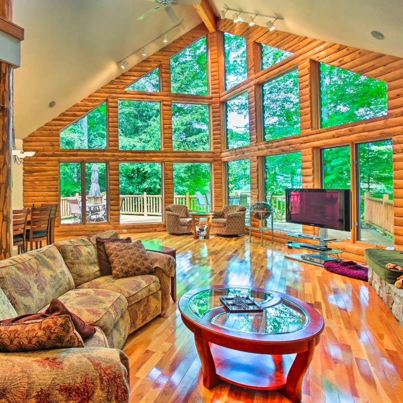 Interior living space with wood floors and large windows