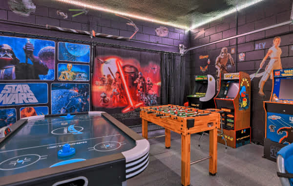 Disney themed game room with bright lights in vacation rental
