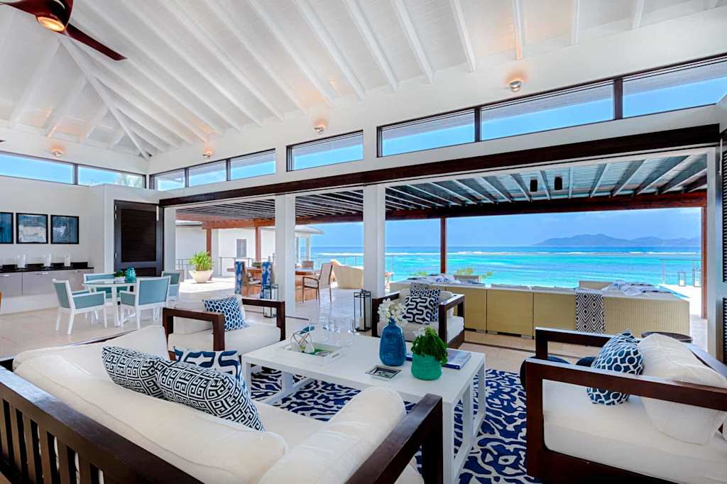 Nautical-themed living room opening out to ocean views