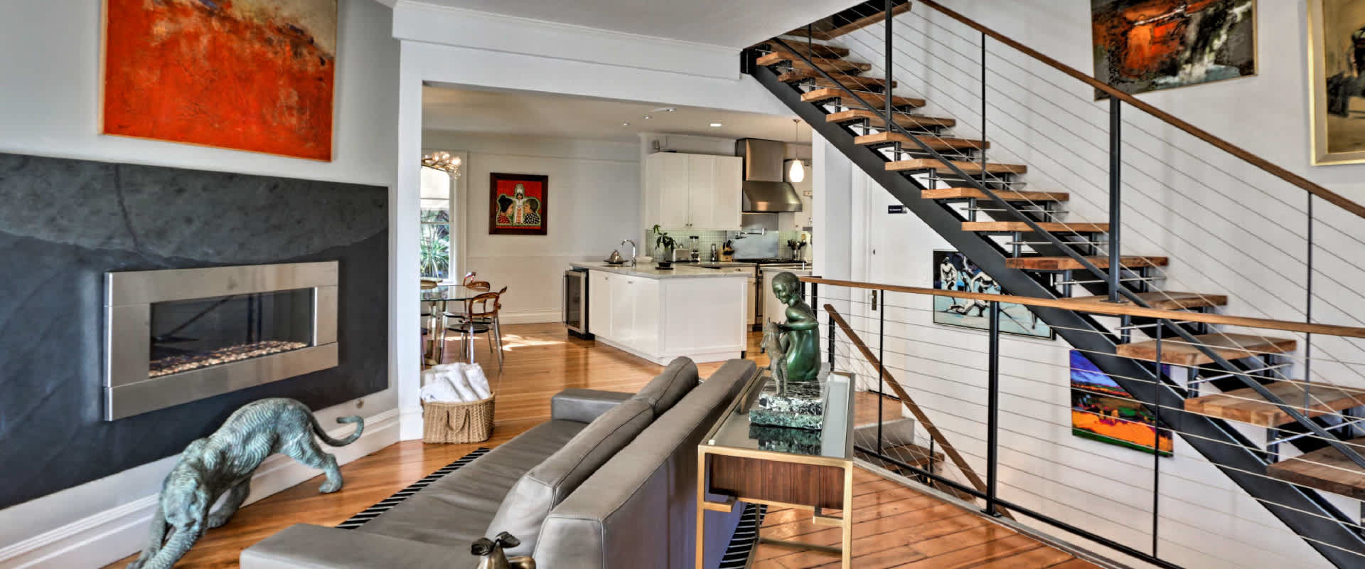 Photo of a modern interior living space at a vacation rental property near Calistoga, California. The open layout gives great lighting to all the art within the rental.