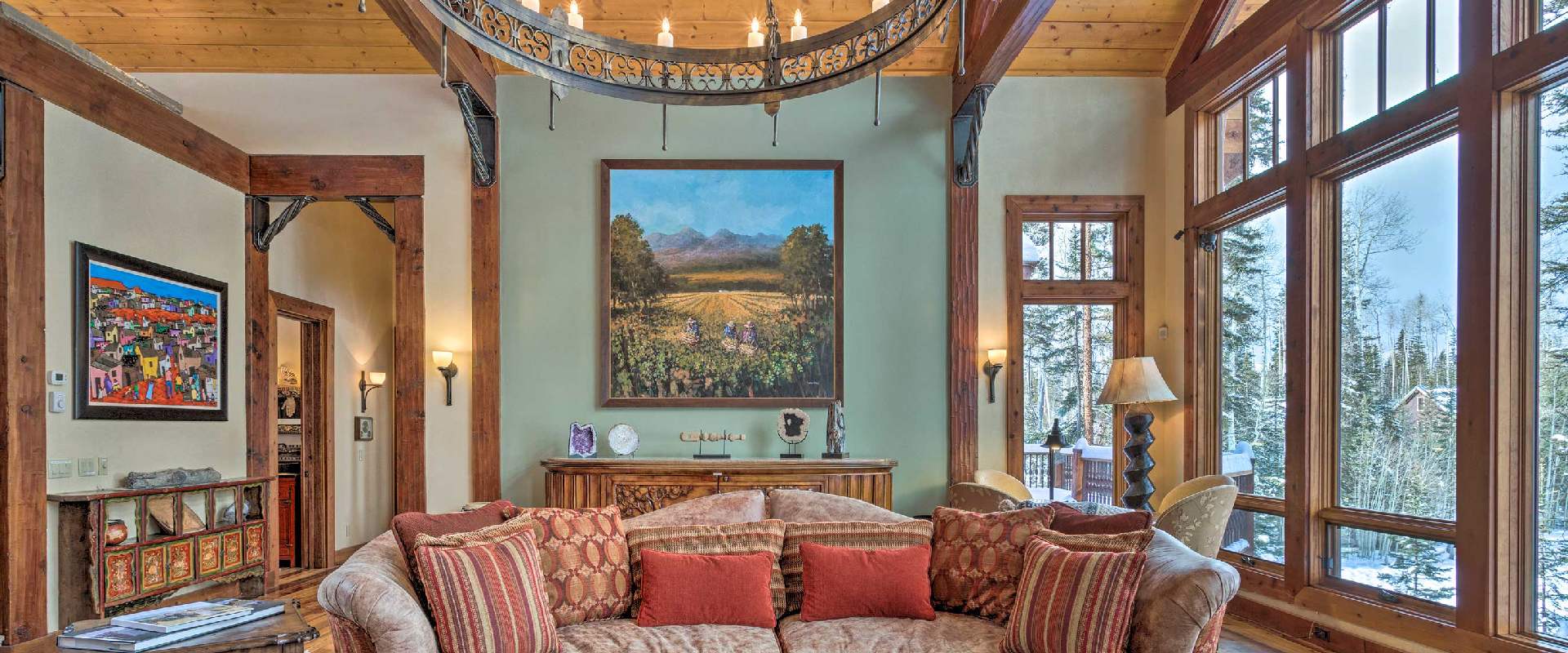 Photo of a rustic styled interior living room space in a vacation rental in Telluride, Colorado during winter.