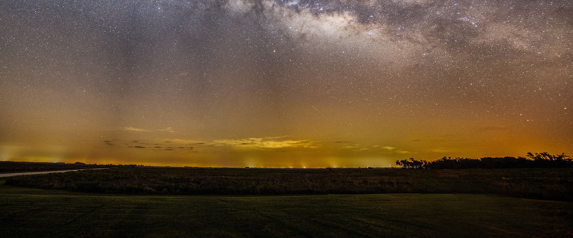 Photo of the starry night sky with the distant glow of city lights near Kissimmee, Florida.