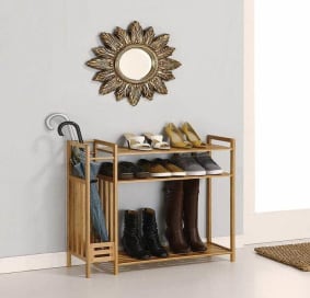 Shoe rack and umbrella stand below decorative mirror