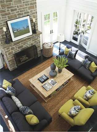 Bird-eye view of sleek vacation rental living room with fireplace and lots of natural light