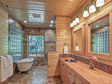 Spacious vacation rental bathroom with stand-alone tub