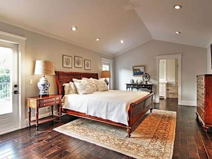 Vacation rental bedroom with lots of natural light and an adjoining bathroom