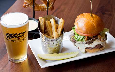 Burger, fries, and a glass of beer at a brewery in the Poconos