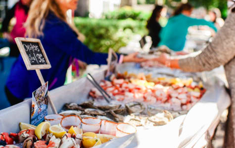 Farmers market showcasing Hilton Head seafood, including oysters