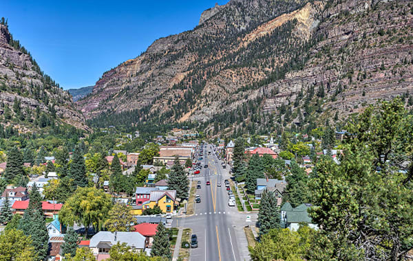 Small town of Ouray, Colorado set against a mountain backdrop