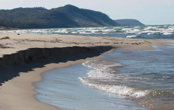 Photo of Sleeping Bear Dunes and lakeshore waves in Traverse City