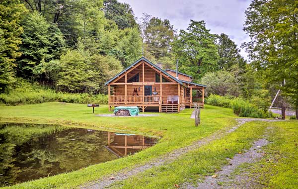 A private, rustic vacation rental cabin on a small pond