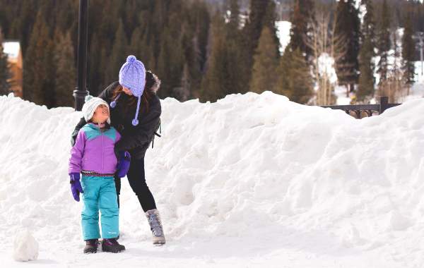 Mother and daughter in the snow playing near Breckenridge, Colorado