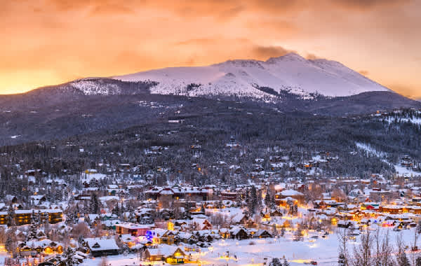 Downtown Breckenridge with snow topped mountains in the background