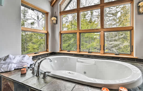 Large bathtub with outdoor views in a vacation rental