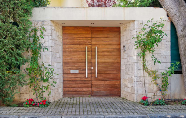Photo of an entryway to a vacation rental with wood doors
