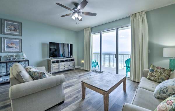 View from inside a beach vacation rental beach with themed beach decor and an ocean view from the balcony