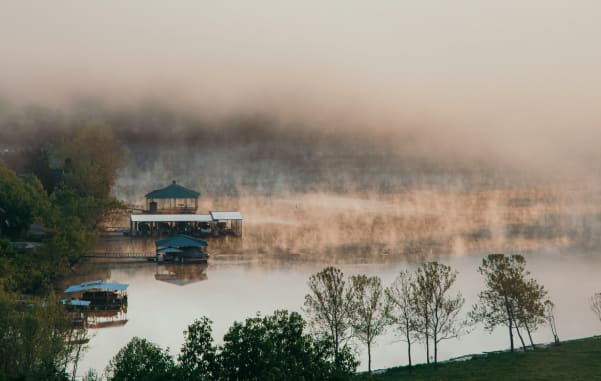 Stunning misty view of Lake of the Ozarks, Missouri, a must-see on your midwest family road trip.