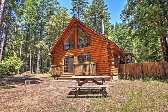 Charming log cabin vacation rental surrounded by trees and nature trails in Sonoma County, California