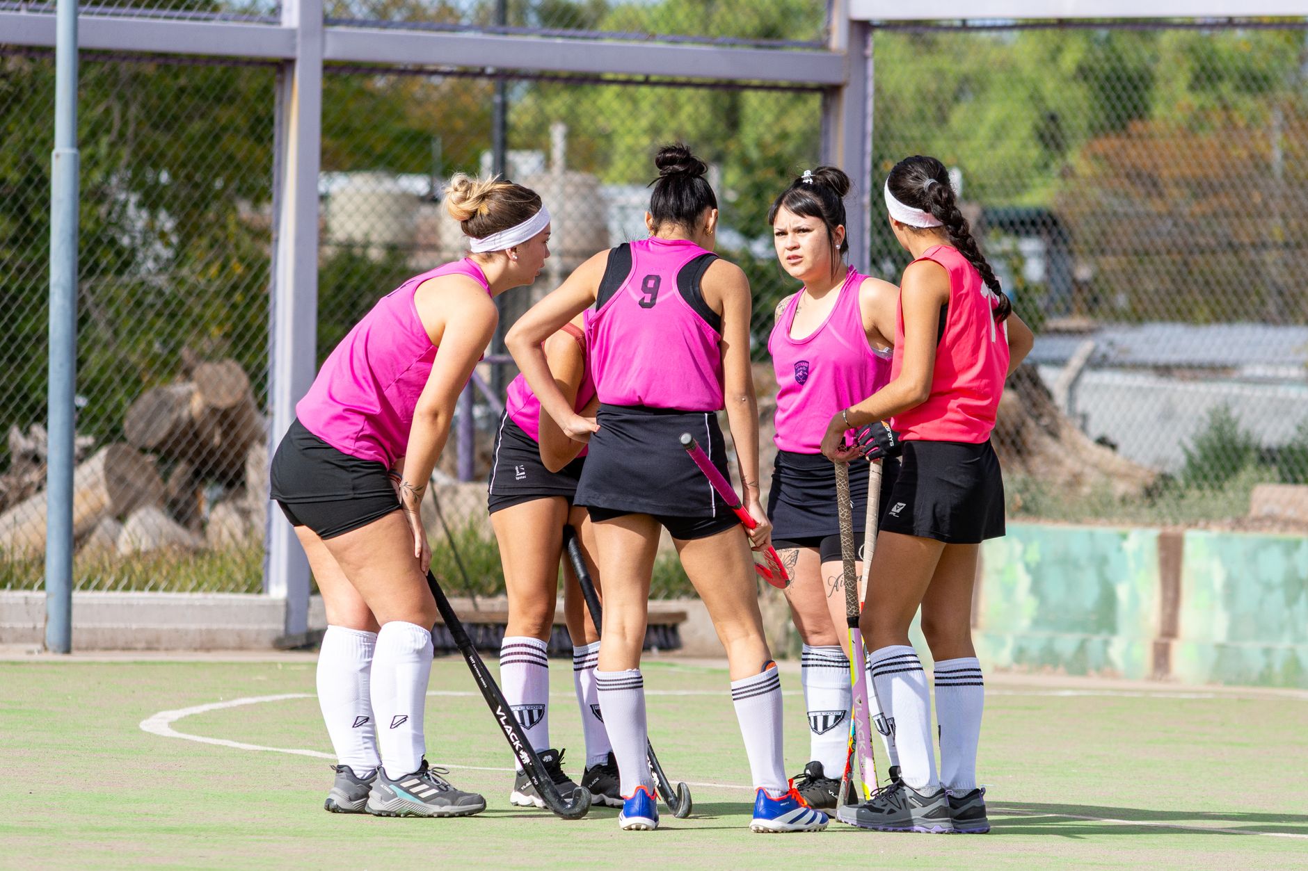 Women S Field Hockey Team in Discussion on Outdoor Court