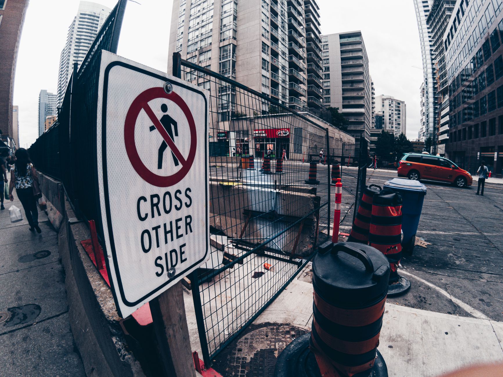 Warning Sign on a Sidewalk