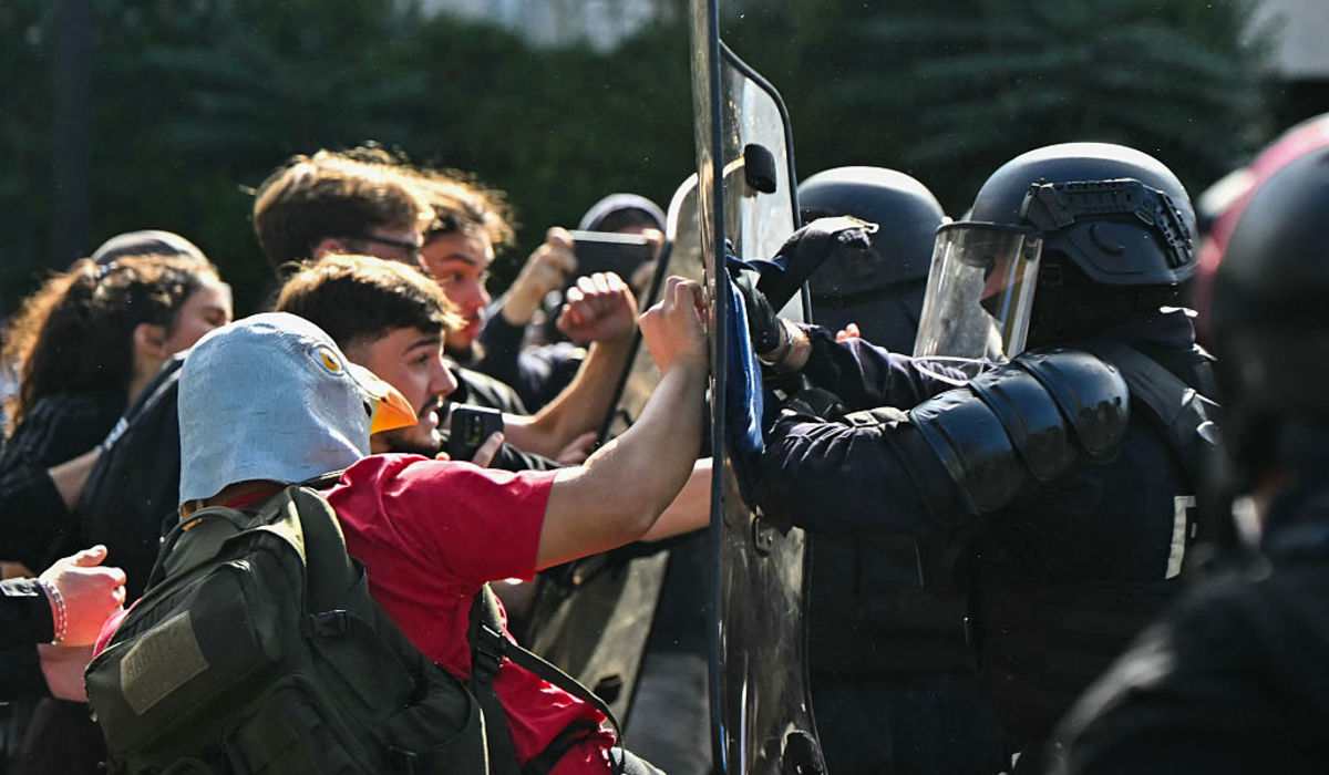 Anti-riot police officers face protesting students carrying out blockading action outside the secondary school Le Corbusier, in Aubervilliers, northern Paris, on Oct. 1, 2026. Since late September, students have staged protests outside schools over grievances ranging from timetables, class sizes, and a shortage of teachers to overheated classrooms during this year’s heat waves. | Credit: Lou Benoist/AFP via Getty Images
