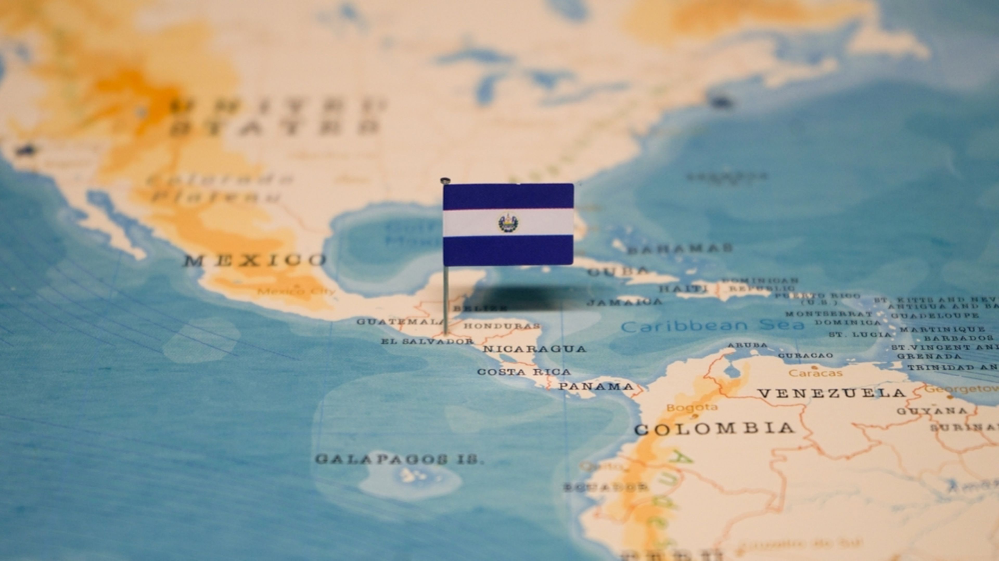 The flag of El Salvador on the world map. | Credit: hyotographics/Shutterstock