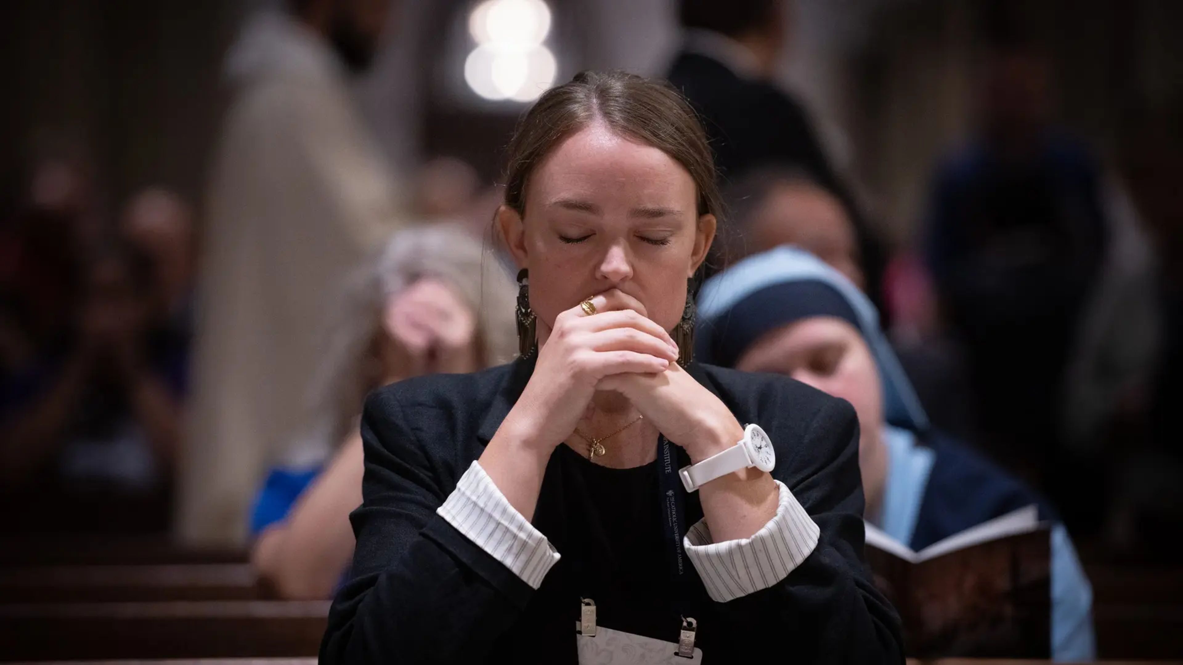 A woman prays in church. | Credit: Jeffrey Bruno